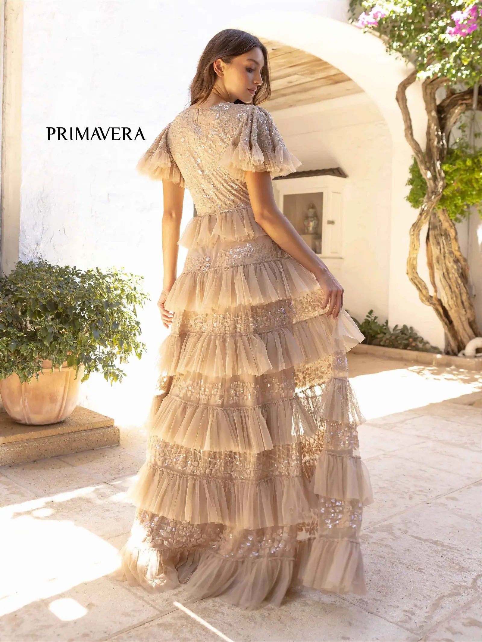 Primavera Couture 12058 Prom Dress Long Beaded gown. This gown has ruffles that go down the skirt. 