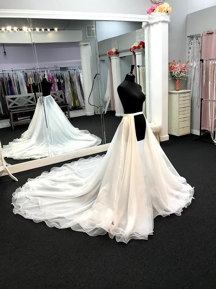 Ashley Lauren 1739 is a Long cathedral length organza multi layered overskirt with a ruffle hem. This Pageant & Bridal Over skirt is a Truly stunning addition to any gown!