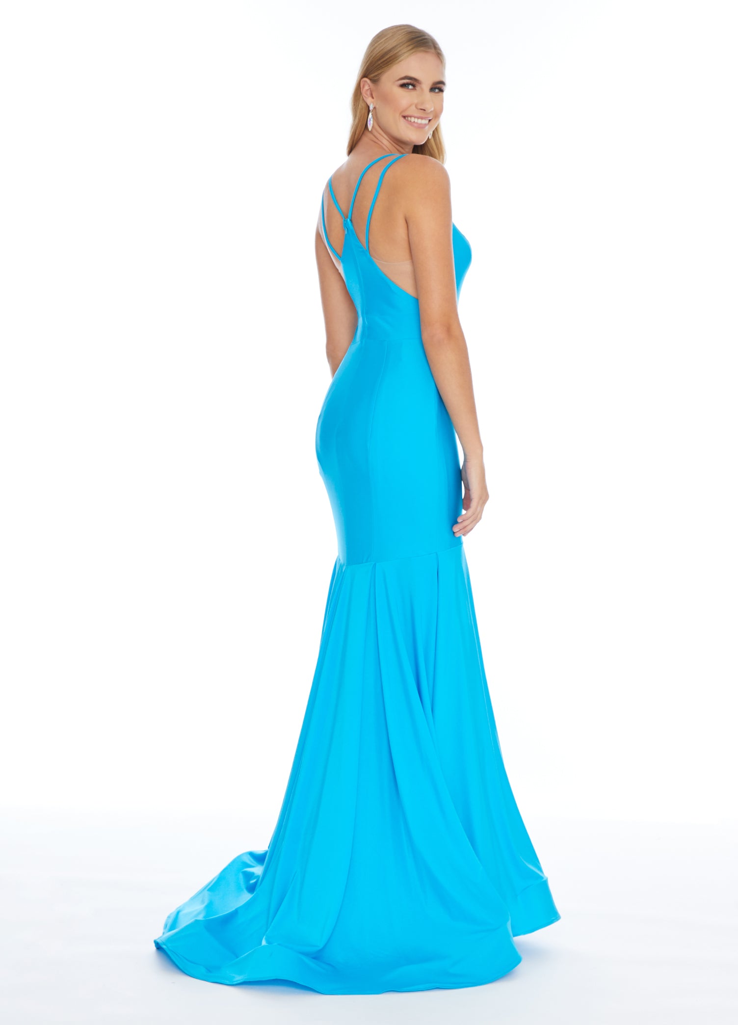 Ashley Lauren 1870 This stunning fit & flare evening gown is sure to turn heads! The bustier is has a v-neckline complete with double spaghetti straps and illusion panel sides. The skirt embellished with box-pleats and sweeping train. Racer Back Jersey  Available Sizes: 6  Available Colors: Turquoise