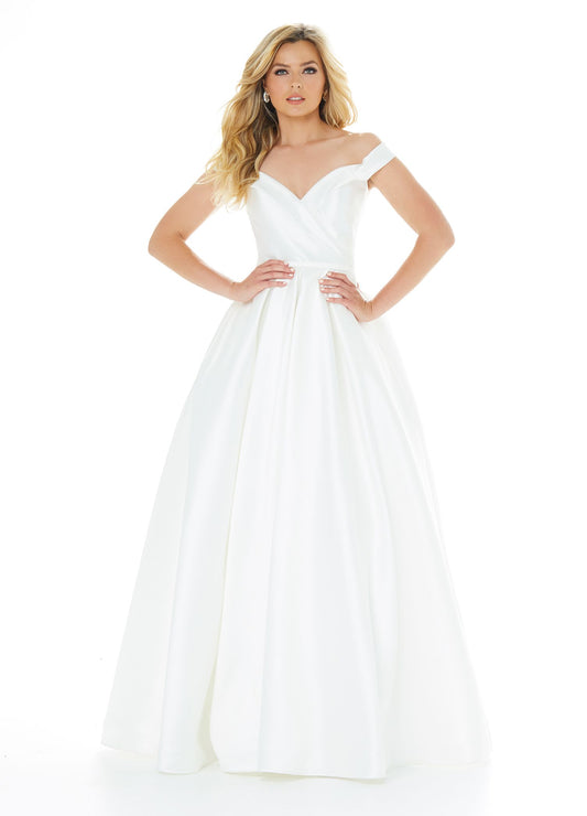 Ashley Lauren 1966 off the shoulder mikado a line simple wedding dress ball gown ivory evening gown or prom dress pageant gown.  Ivory size 22  Available colors:  Ivory  Available sizes:  0, 2, 4, 6, 8, 10, 12, 14, 16, 18, 20, 22  Simple and stunning mikado ball gown featuring an off the shoulder wrap detail. The A-Line skirt is completed with box pleats and pockets.  Mikado Off Shoulder A-Line Silhouette Pockets