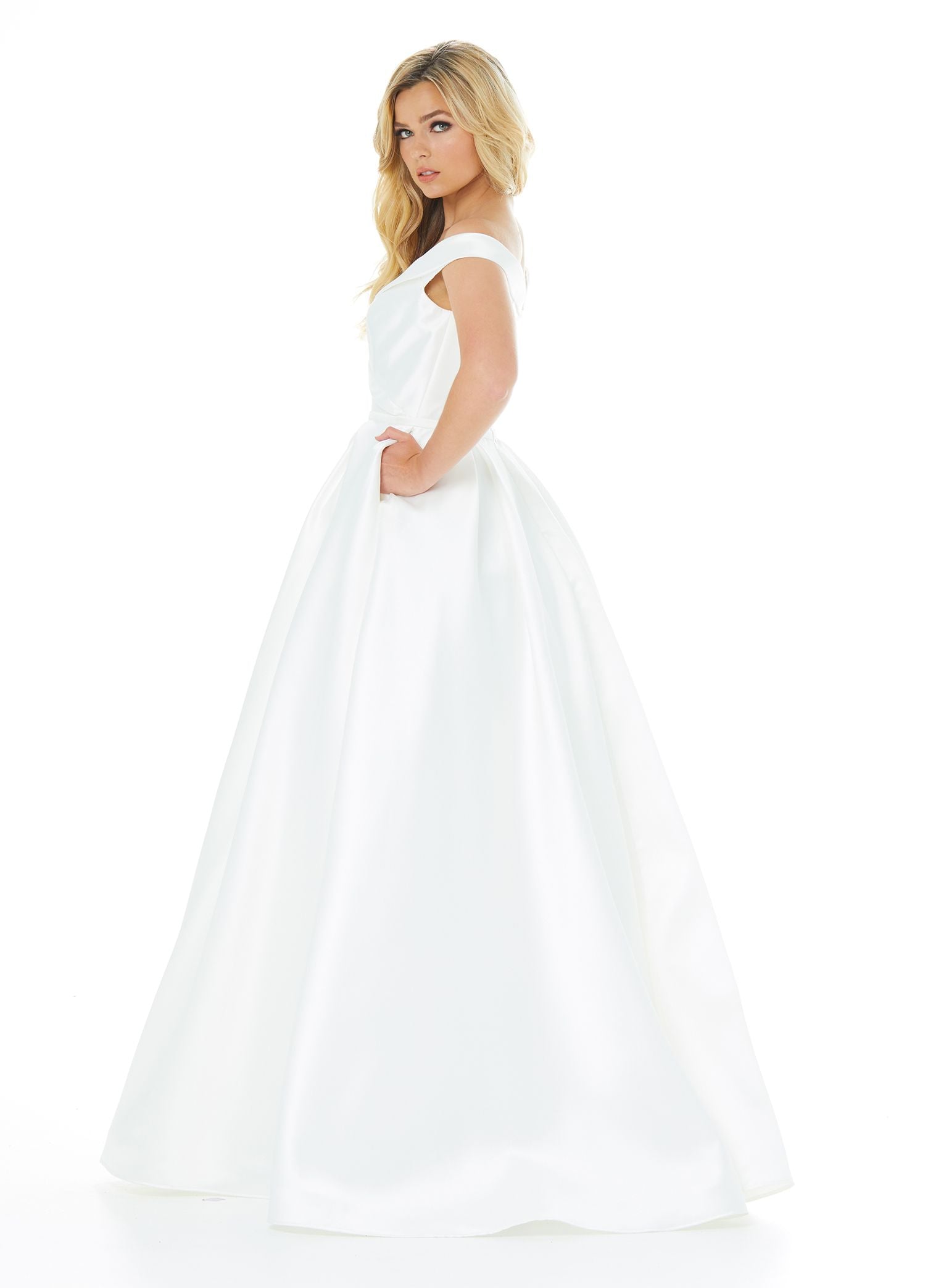 Ashley Lauren 1966 off the shoulder mikado a line simple wedding dress ball gown ivory evening gown or prom dress pageant gown.  Ivory size 22  Available colors:  Ivory  Available sizes:  0, 2, 4, 6, 8, 10, 12, 14, 16, 18, 20, 22  Simple and stunning mikado ball gown featuring an off the shoulder wrap detail. The A-Line skirt is completed with box pleats and pockets.  Mikado Off Shoulder A-Line Silhouette Pockets