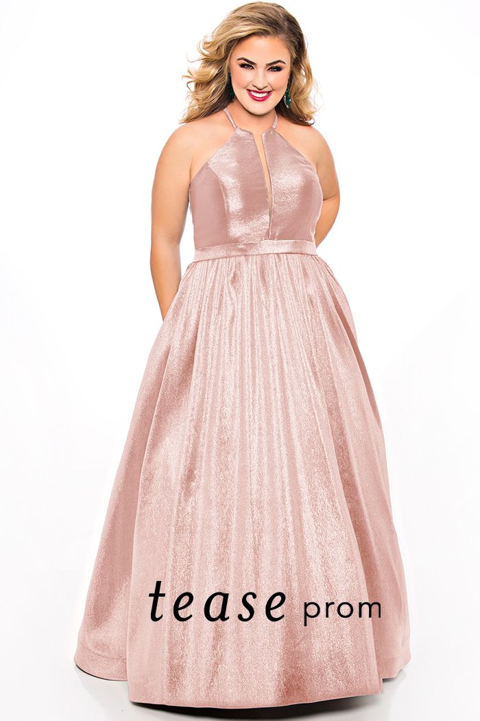 Tease Prom TE2019 high neckline shimmer prom dress ball gown.  Ramp up the glamour in this glimmering prom dress. The sleeveless halter neckline forms a dazzling deep V-bodice with a lace-up keyhole back. The unique two-tone satin shimmer fabric will be the talk of the town.  Full A-line skirt with pockets finishes off this vibrant prom or special event dress.  Time to shine in Cotton Candy, Ice Blue or Peacock.