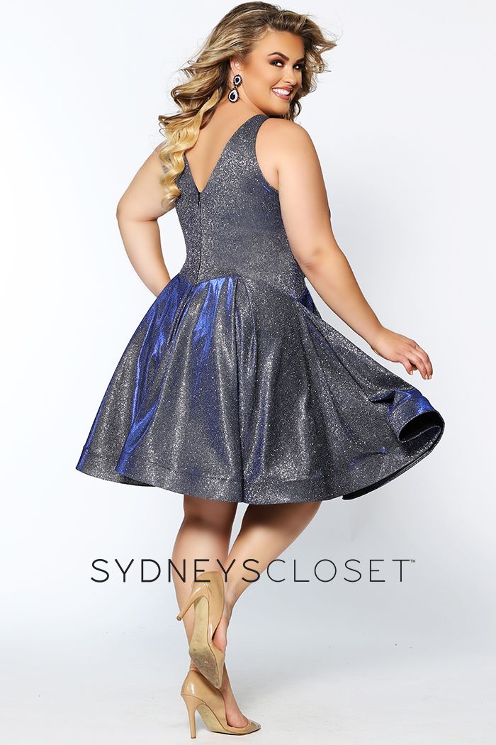 Sydney's Closet 8100 This is a super trendy plus sized V neckline holographic short formal cocktail dress that is knee length.  This short prom dress has wide straps and is bra friendly.  The homecoming dress has a basque waistline and pleated skirt with horsehair trim.  Colors  Cosmic Cobalt, Sonic Silver  Sizes  14, 16, 18, 20, 22, 24, 26, 28, 30, 32