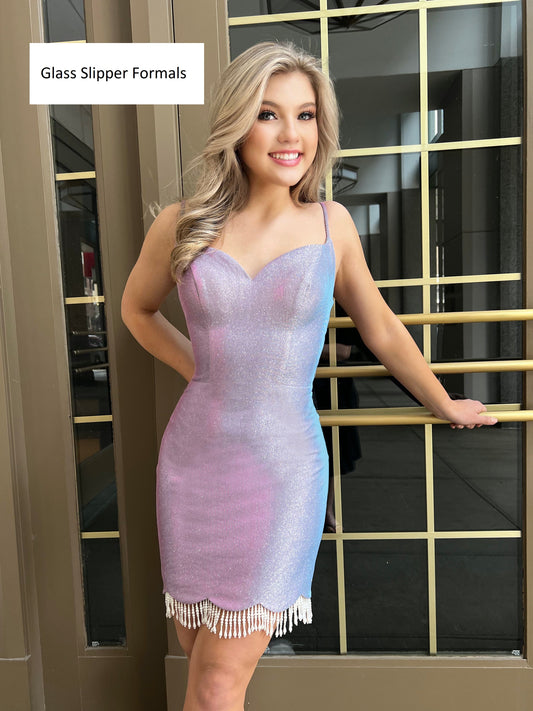 Blush Prom 20412 is a Short Fitted shimmering Cocktail Dress. Featuring a scalloped hem with faux Pearl Fringe accents. This Formal Gown has an open back with a lace up corset closure.  Available Sizes: 0-24  Available Colors: Lavender/Pearl, Pink/Pearl