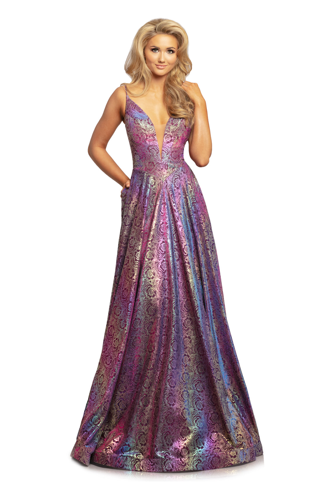 Johnathan Kayne 2094 is an iridescent Royal Blue Prom Dress, Pageant Gown & Formal Evening Wear. This long Gown Features a Metallic Glitter Floral Rose Design with a plunging neckline and spaghetti straps. This fitted bodice flows into a beautiful color changing A line skirt.