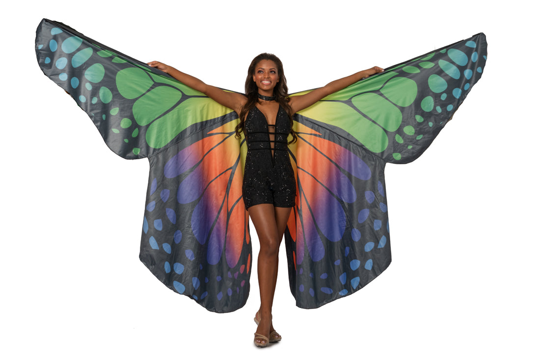 Johnathan Kayne 2100 is a Butterfly Wings Romper Crystal Embellished Lace Romper. Featuring a Plunging neckline with a mesh insert and sheer cutout side panels. Horizontal Waist accent belts. Featuring a Monarch Butterfly Halter Cape with extended reach. 