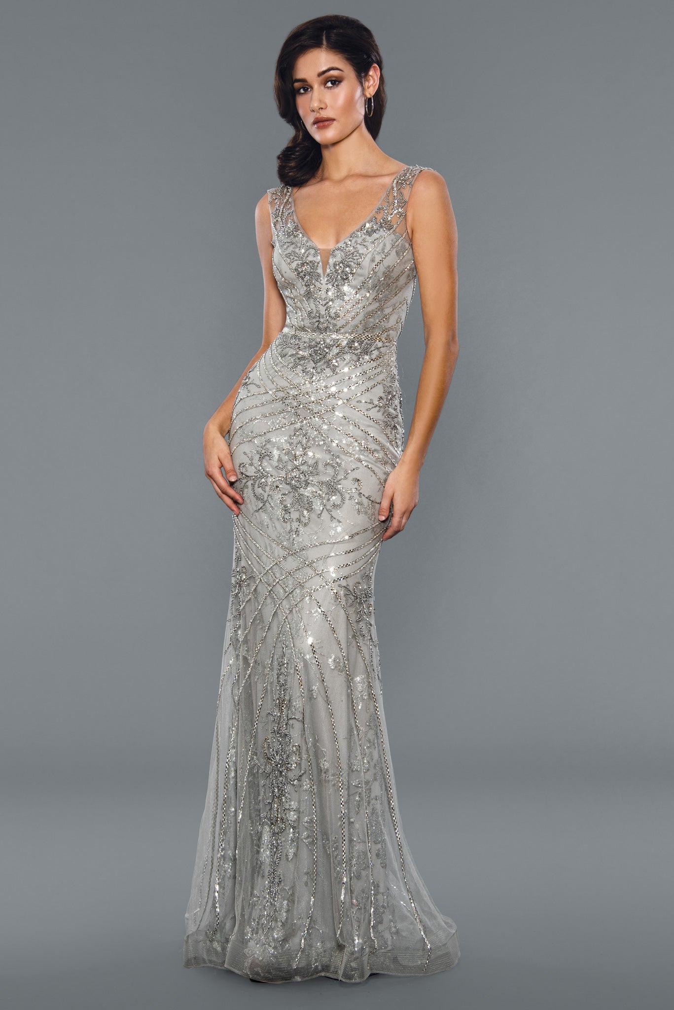 Stella Couture 21048 Long beaded Rhinestone embellished formal dress prom pageant. Stella Couture's 21048 Long Shimmer Beaded Evening Dress is the perfect choice for formal occasions. Crafted with intricate beadwork detail, this figure-flattering gown features a full length design with a classic scoop neckline and tulle-lined skirt for added movement. A breathtaking choice for these special occasions