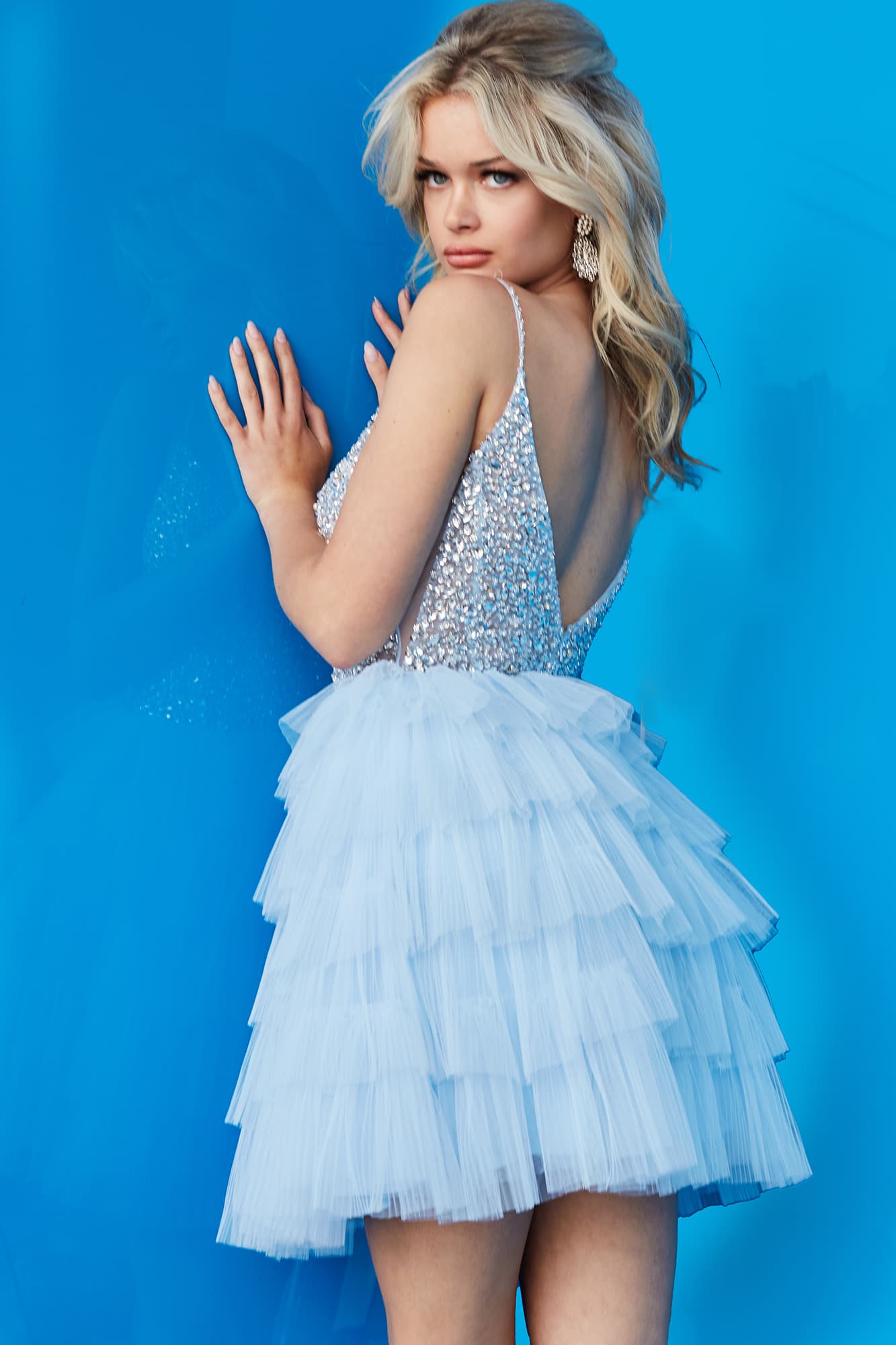 Jovani 22604 Short Layered Tulle Formal Cocktail Dress Pleated Sheer Crystal Bodice Gown Short fit and flare light blue Jovani homecoming dress 22604 features tulle layered skirt and Crystal Rhinestone beaded bodice with sheer sides and plunging neckline  Available Sizes: 00,0,2,4,6,8,10,12,14,16,18,20,22,24  Available Colors: Cafe, Light Blue