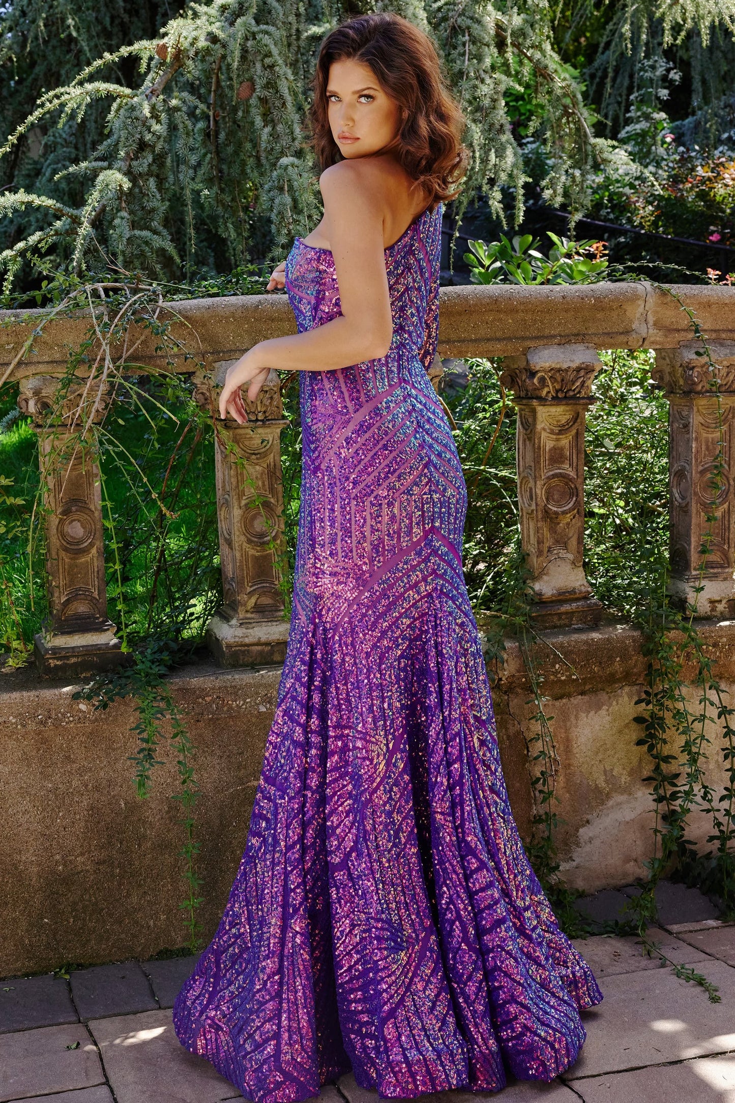 Jovani 24098 One Shoulder Long Sleeve Fitted Sequin Mermaid Prom Dress Pageant Gown Jovani 24098 is the perfect choice for a special occasion. It features a one-shoulder neckline, long sleeves, and a mermaid silhouette adorned with fantasy sequins. This fitted gown is designed to flatter, making you look and feel amazing.  Sizes: 00-24  Colors: EMERALD, IREDENSCNT BLUE, IRIDESCENT VIOLET, NEON HOTPINK, PEACOCK