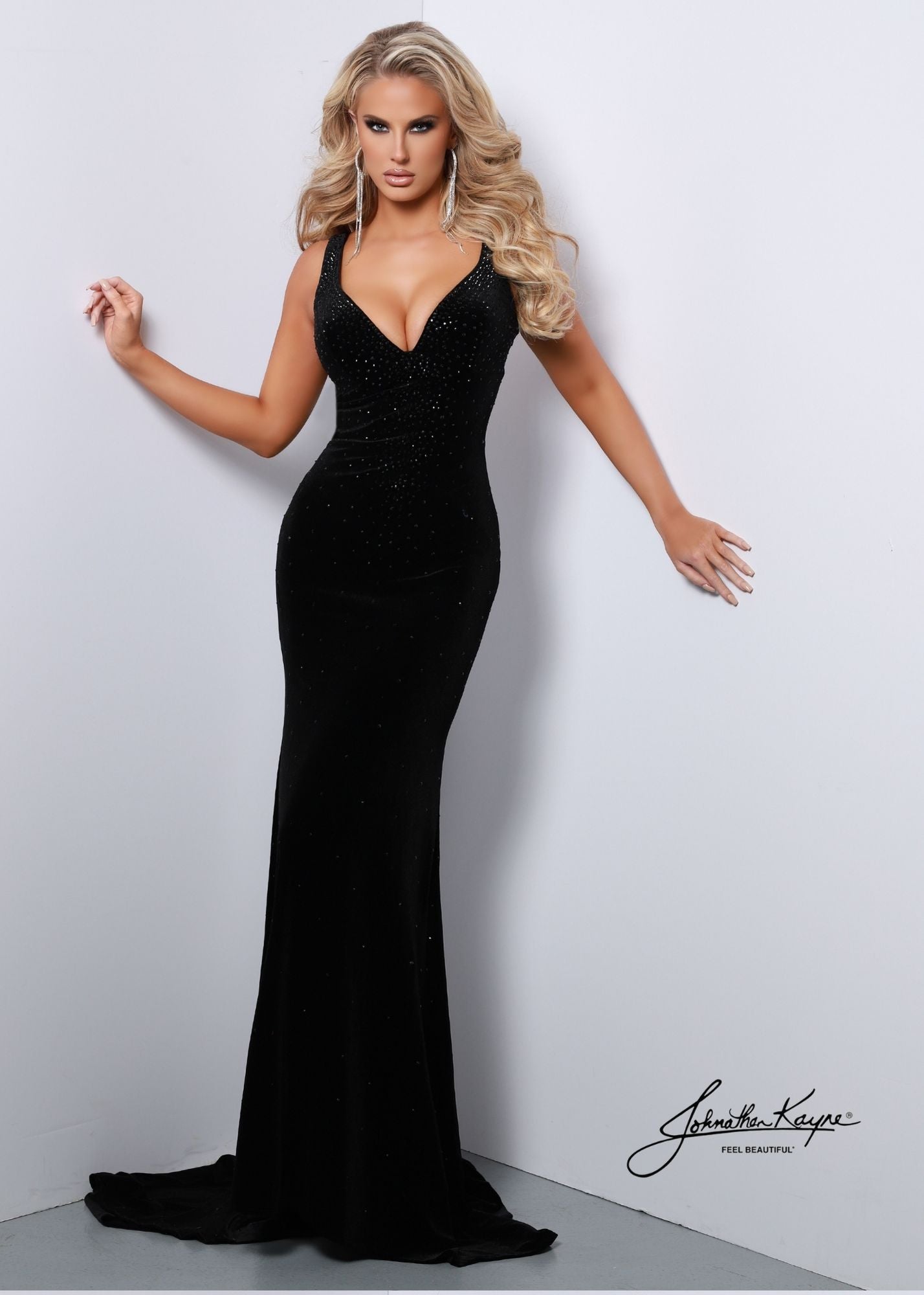 Johnathan Kayne 2445V Long Backless Velvet Crystal Prom Dress Formal Pageant Gown One of JK fan faves, 2445 but in VELVET! The criss-cross back is flattering to the frame and the hot-fix crystals make this gown sparkle all night long.  Colors: Emerald, Black  Sizes: 00, 0, 2, 4, 6, 8, 10, 12, 14, 16  Fabric Stretch Velvet, Stretch Lining