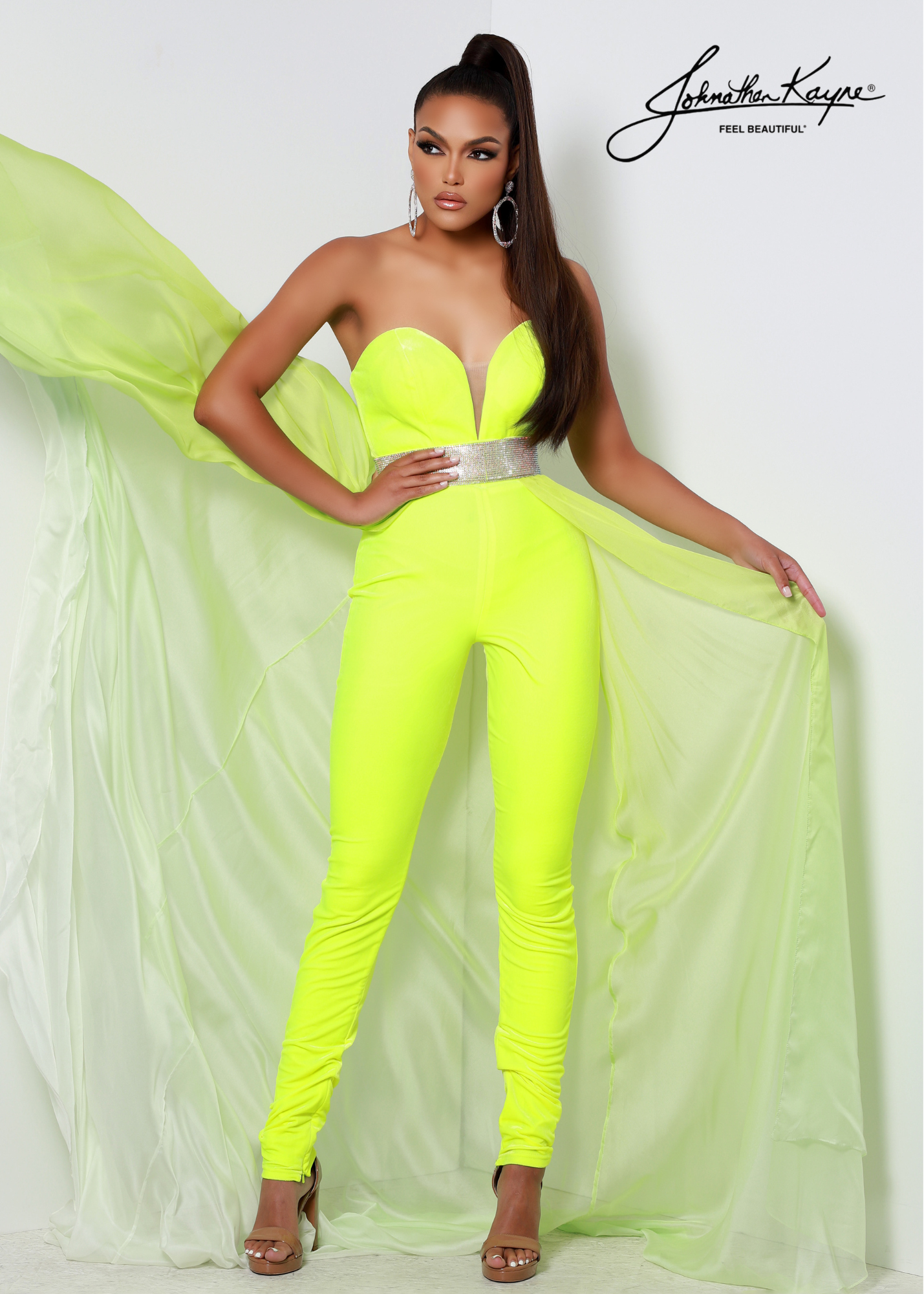 Johnathan Kayne 2609 Long Velvet Jumpsuit Chiffon Overskirt Crystal Waist Pageant Fun Fashion Rock out your next fun fashion event in this dazzling stretch velvet fitted jumpsuit with detachable ombre chiffon overskirt. The rhinestone waist band will be sure to highlight your waist!  Sizes: 10  Colors: Neon Yellow