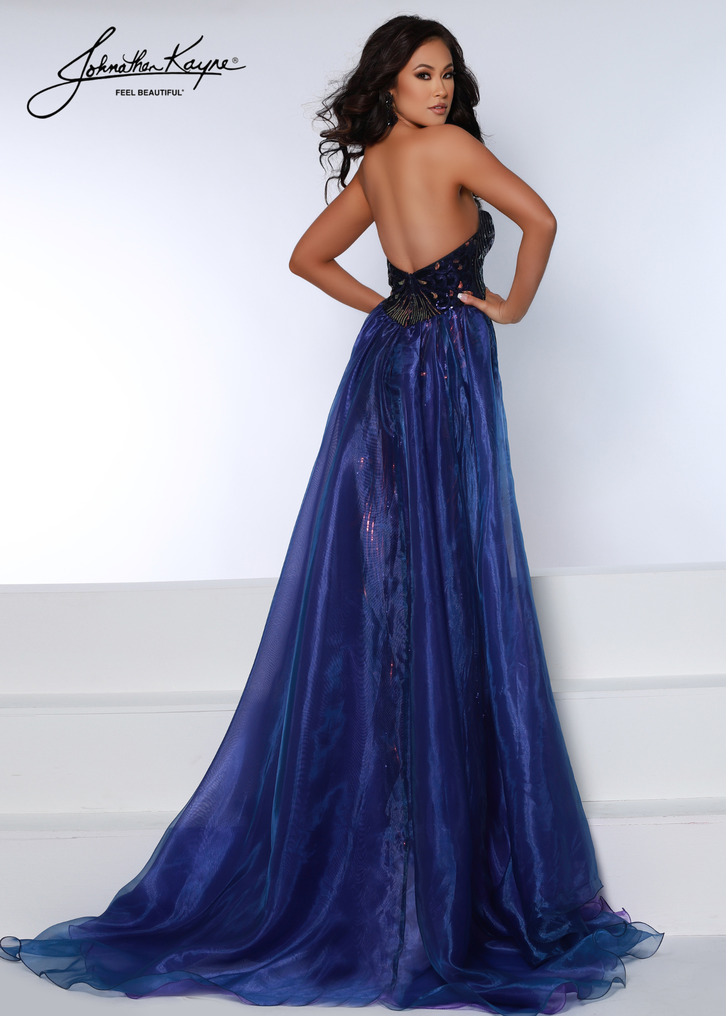 Johnathan Kayne 2709 Long Fitted Sequin Velvet Formal Dress Overskirt Prom Dress Pageant Chic happens! This strapless sequin stretch velvet gown is completed with an overskirt and sexy thigh-high slit   Sizes: 00,0,2,4,6,8,10,12,14,16  Colors: Midnight