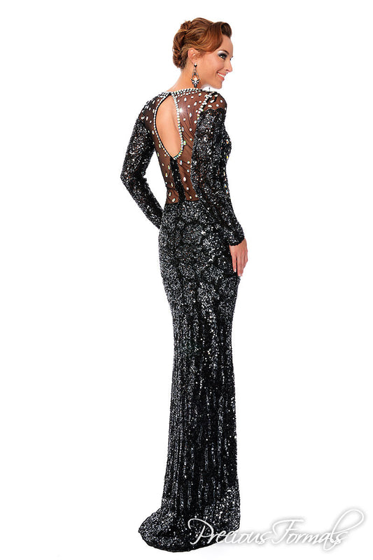 Precious Formals P 9091 is a slim fit fully hand beaded prom dress evening gown with illusion top and fully beaded long sleeves with illusion waist design and side slit.