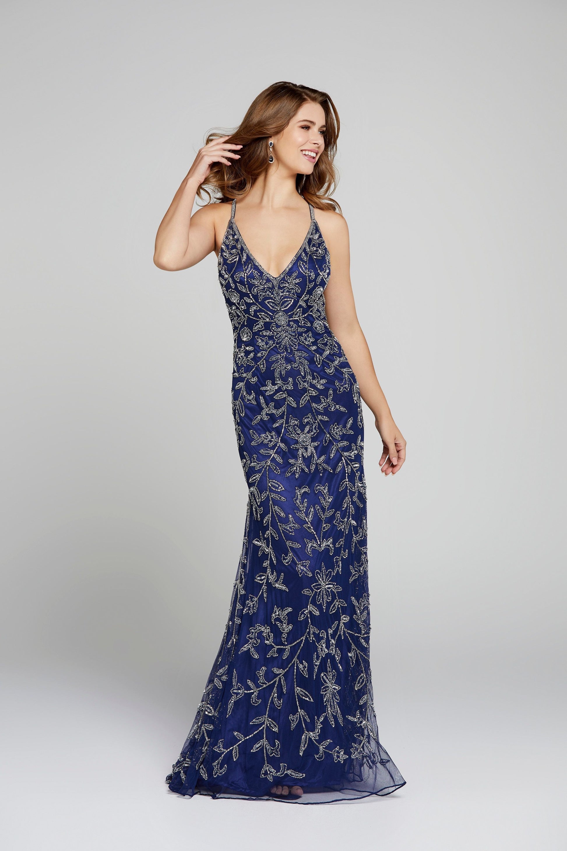 Primavera Couture 3414 is a long sequin beaded Prom Dress, Pageant Gown & Formal Evening Wear gown. This v neckline beaded evening gown Features criss cross straps in the open back. and small train. Midnight blue front full view