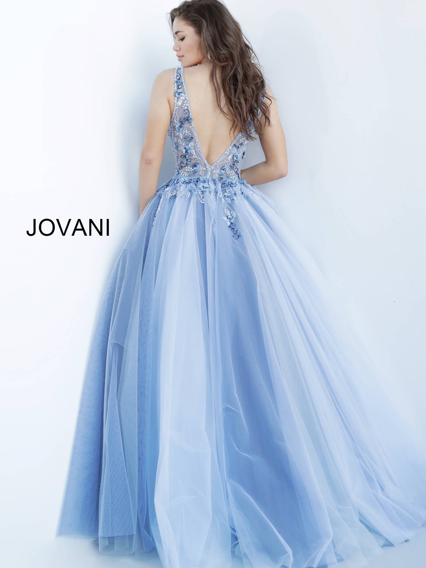 Jovani 3110 is a stunning tulle ball gown Prom Dress. Embellished 3D Floral Appliques on Sheer Illusion Bodice. Deep V Neckline & Back.  This gown would be a Perfect Sexy Wedding Dress In Ivory!  Available Sizes: 00, 0, 2, 4, 6, 8, 10, 12, 14, 16, 18, 20, 22, 24  Available Colors: blue, ivory, red