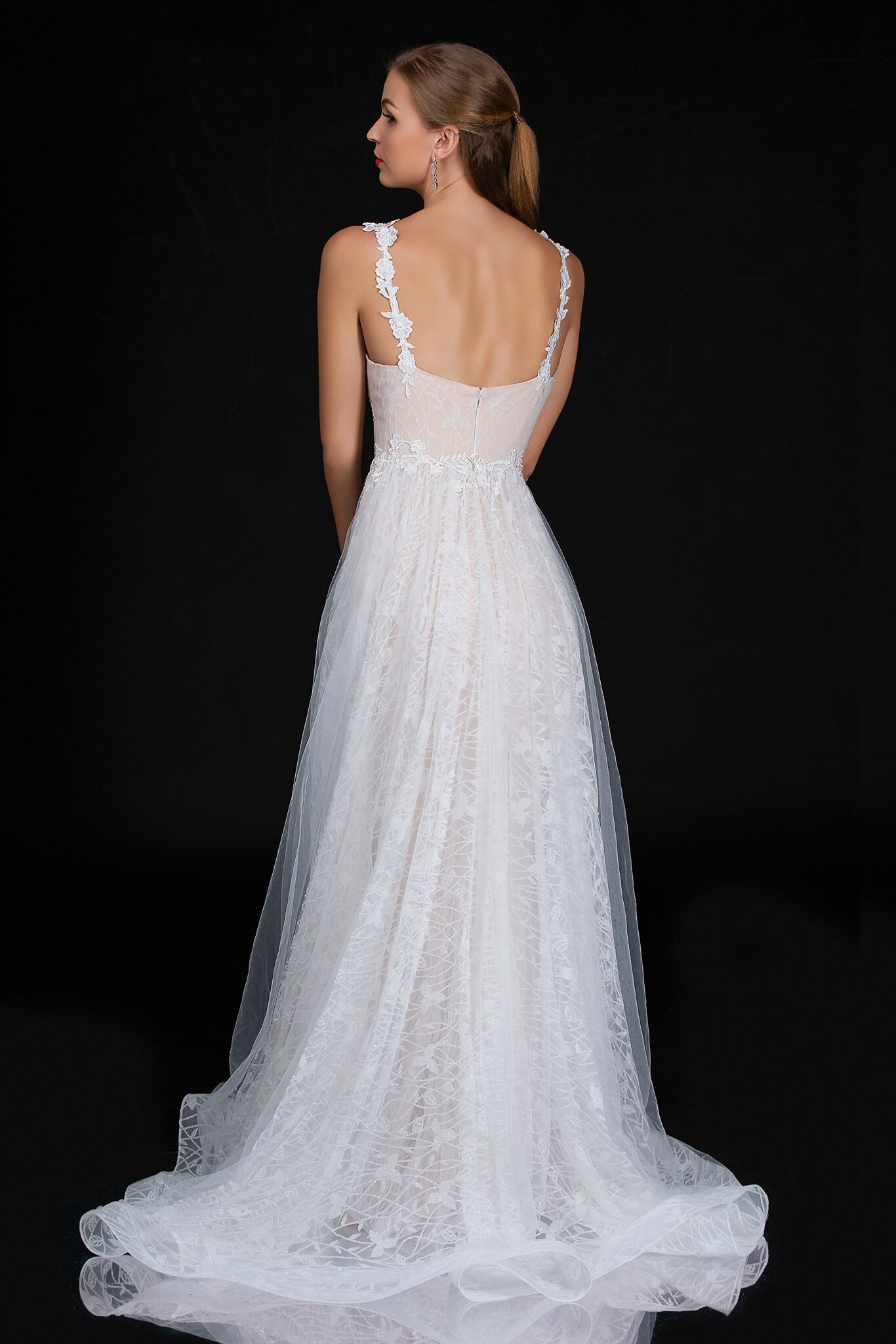 Nina Cancci 3159 is a long Lace Fitted Ivory Floral Lace Applique strap wedding dress. cracked Ice Over skirt and sweeping train. Stunning Destination Bridal Gown. Great for Plus Size! Glitter sweetheart neckline. Accented scroll pattern on the flowing overskirt. shimmering bridal gown or unique wedding dress. Sheer lace embellished straps.   Available Sizes: 8  Available Colors: Ivory/Nude