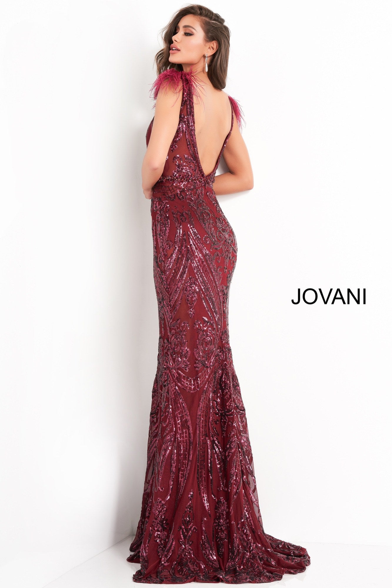 Jovani 3180 is a sequin prom dress, pageant gown & Formal evening wear. This gown features a sheer sequin embellished corset bodice with a plunging neckline. feathers accent the shoulder straps leading to an open v back. Embellished Waist belt.   Available Colors: black, merlot, navy, white  Available Sizes: 00,0,2,4,6,8,10,12,14,16,18,20,22,24