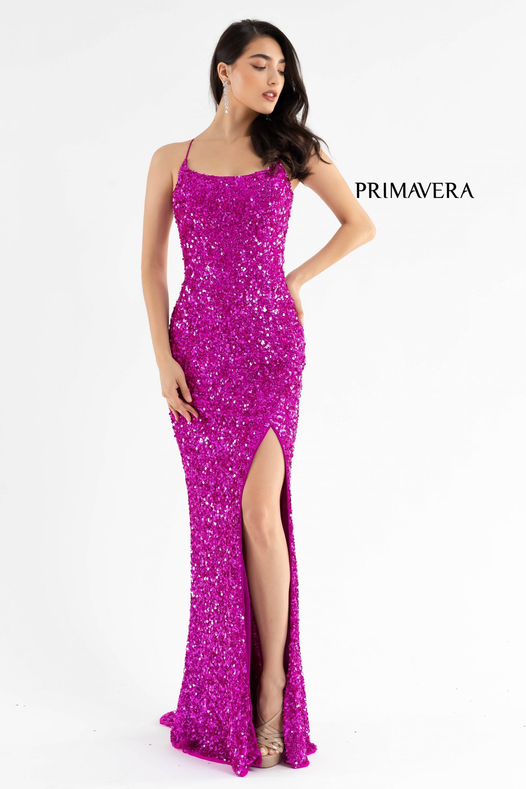 Primavera Couture 3290 This prom dress adds a pop to the multi sequins dress.  With a scoop neckline and spaghetti straps that cross and tie in the back.  This long evening dress has a side slit.  Available sizes:  000, 00, 0, 2, 4, 6, 8, 10, 12, 14, 16