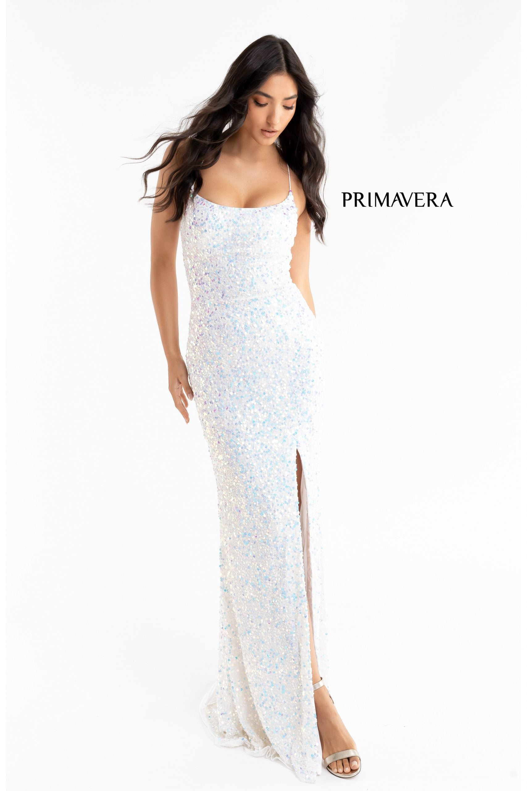 Primavera Couture 3290 This prom dress adds a pop to the multi sequins dress.  With a scoop neckline and spaghetti straps that cross and tie in the back.  This long evening dress has a side slit.  Available sizes:  000, 00, 0, 2, 4, 6, 8, 10, 12, 14, 16