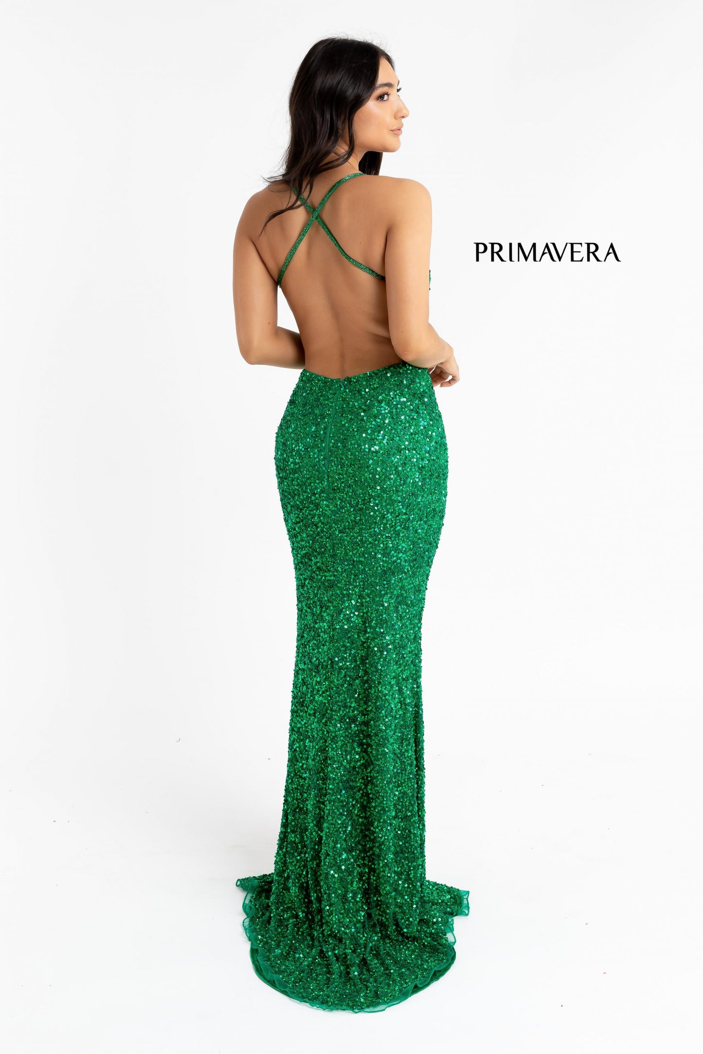 Primavera Couture 3291 Exclusive Prom Dresses.  This long prom dress is embellished throughout with shimmering sequins.  This impressive gown showcases a v neckline, thin beaded straps and crisscrossed straps in the open back. The long slim skirt has a sultry high side front slit. 