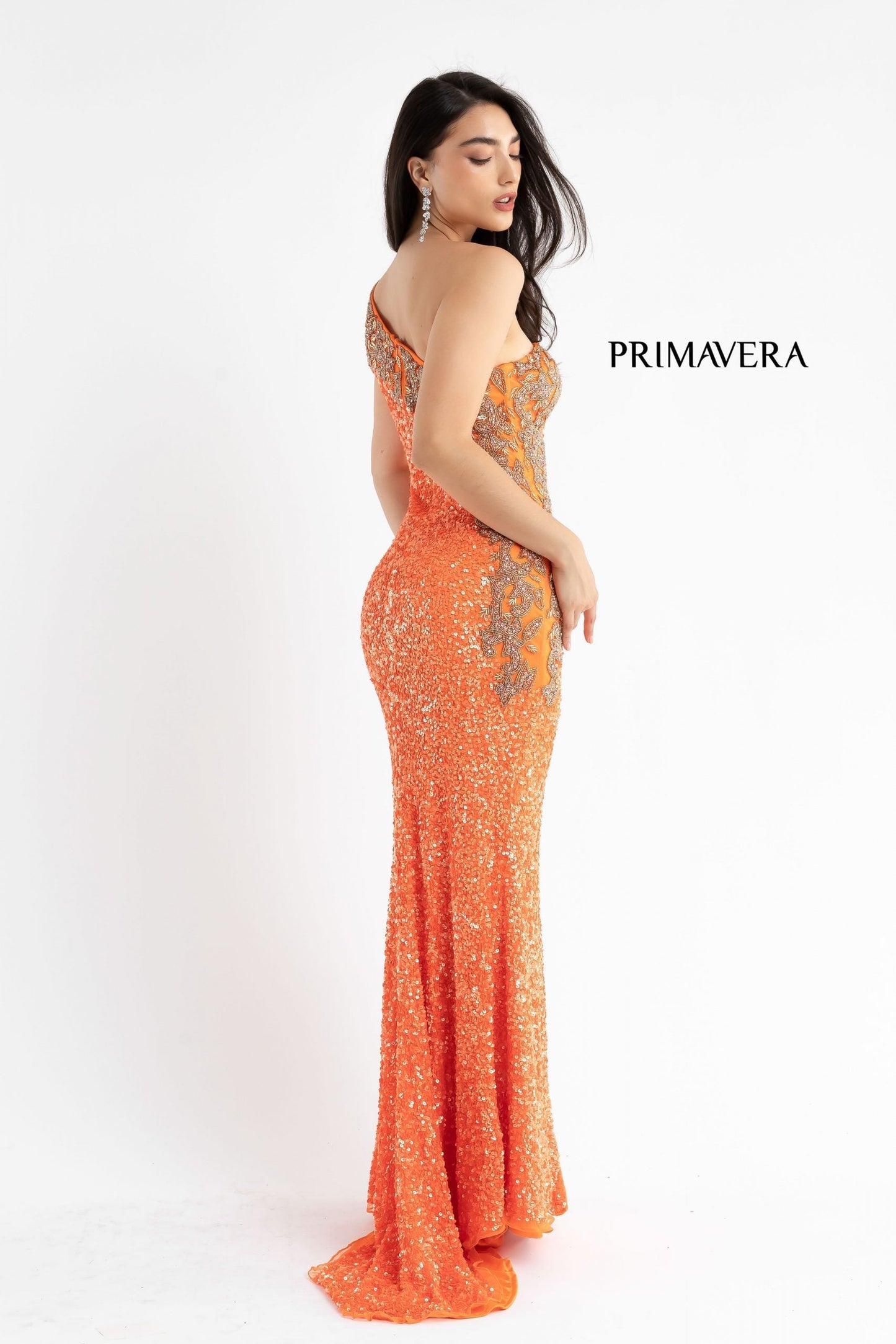 Primavera Couture 3637 is a stunning Long Fitted Sequin Embellished Formal Evening Gown. This One Shoulder Prom Dress Features Beaded Embellishments cascading from the one shoulder neckline down the side of the gown along the hip. Slit in skirt with a sweeping train. Great Pageant Formal Style.