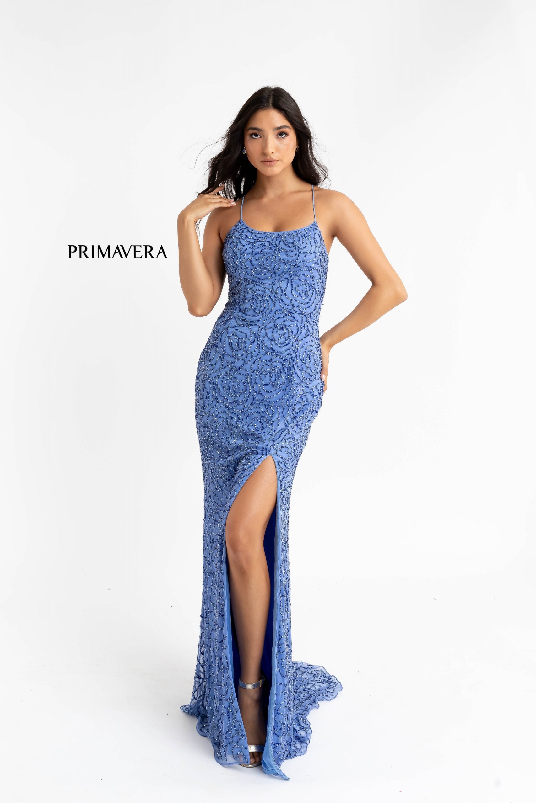 Primavera Couture 3638 is a stunning Long Fitted Formal Evening Prom Dress. Featuring Beaded Floral Embellishments along the entire evening gown. Scoop neckline with spaghetti straps leading around to an open back with a lace up tie corset closure. Slit in skirt and sweeping train. Great Prom & Pageant Style!