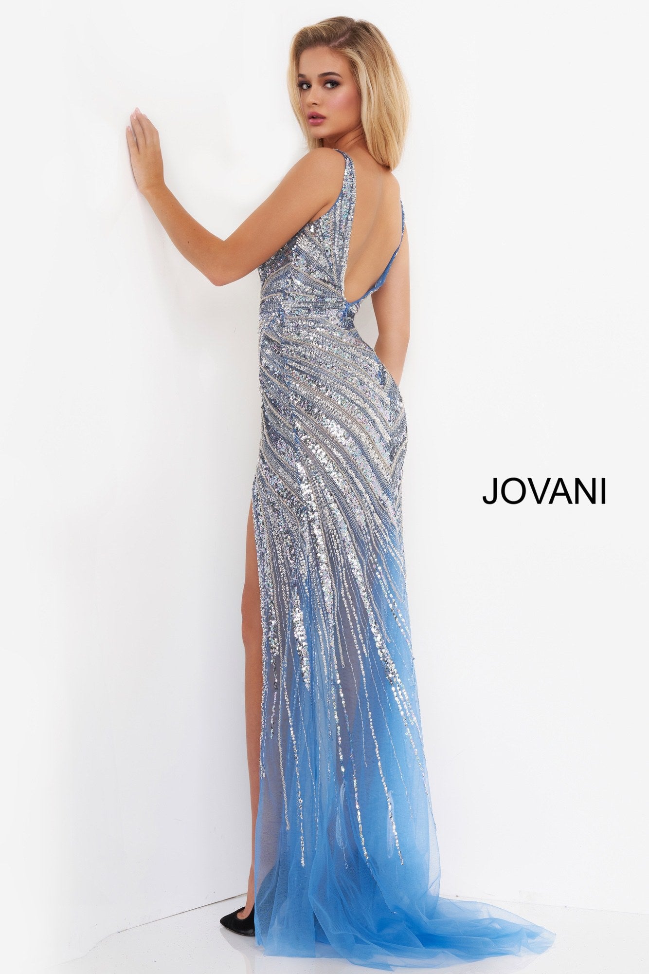 Jovani 3686 is a 2020 Prom Dress, Evening Gown, Pageant Dress & Formal Wear Attire. Featuring a Fully Crystal Embellished asymmetrical Bodice with detailed beading. Plunging V Neckline with high slit sheath silhouette with sheer mesh skirt.   Available Sizes: 00, 0, 2, 4, 6, 8, 10, 12, 14, 16, 18, 20, 22, 24  Available Colors: gold/silver, perriwinkle, platinum