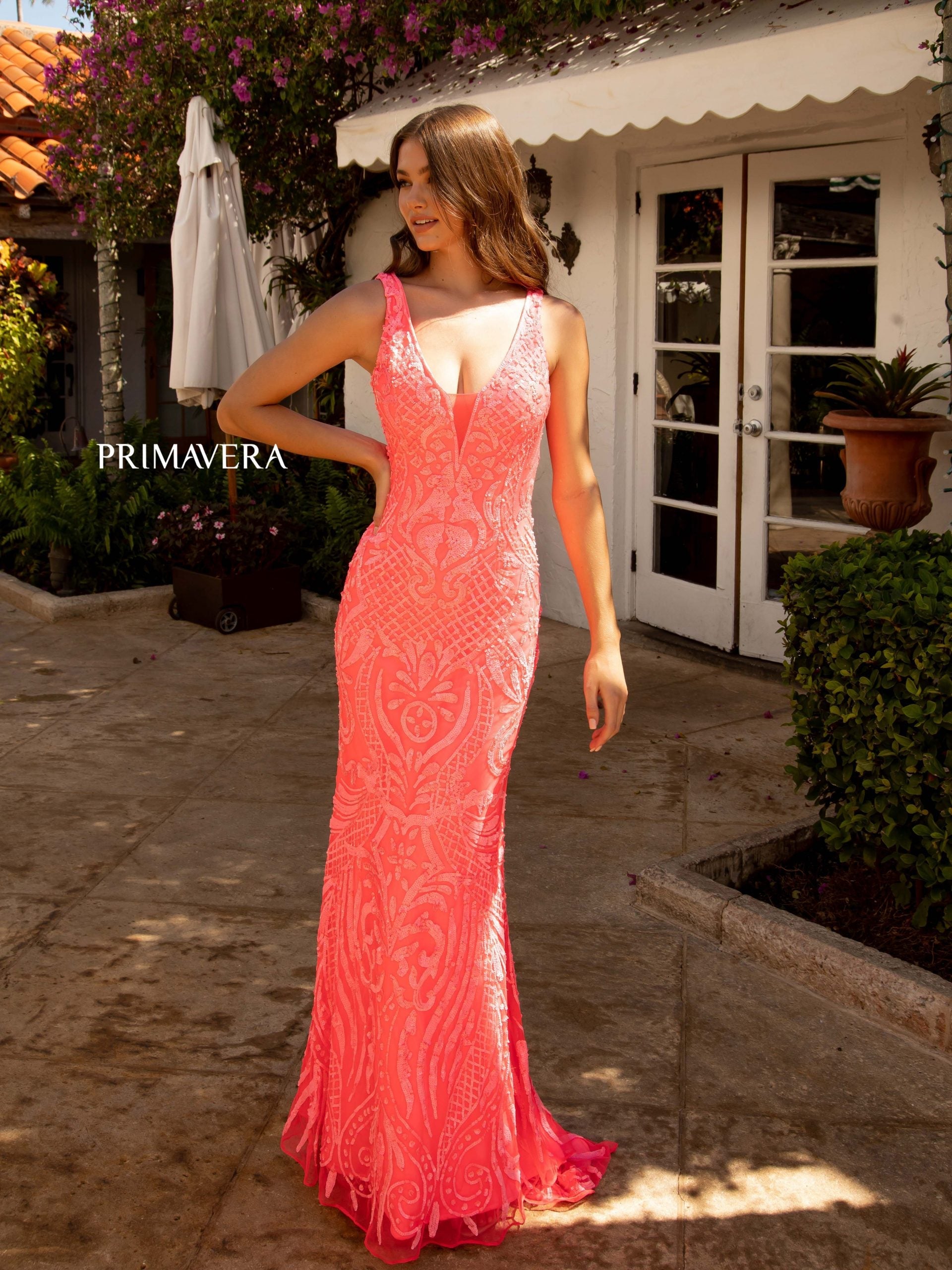 Primavera Couture 3722 This is a long sequins prom dress with a low v neckline that has a sheer courtesy panel and a mid v back.  It has beautiful iridescent patterned sequins throughout.  This is a perfect choice for your next prom, pageant or formal evening gown.