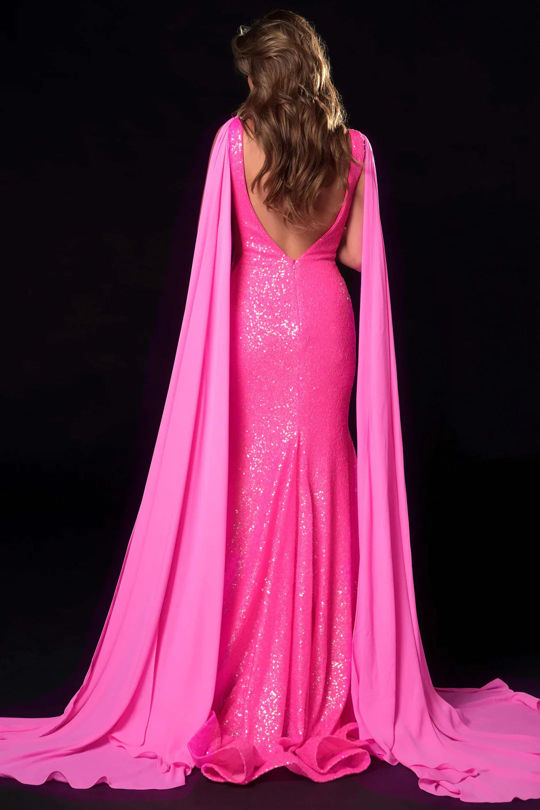Ava Presley 37346 is the perfect choice for the discerning pageant or prom goer. Featuring a long, fitted mermaid silhouette decorated with dazzling sequins and detachable cape sleeves, this gown also has a V-neck cut and sheer mesh side panels. Its elegant design is sure to turn heads.  Sizes: 0-26  Colors: Red, Royal, Black, Neon Orange, Neon Hot pink