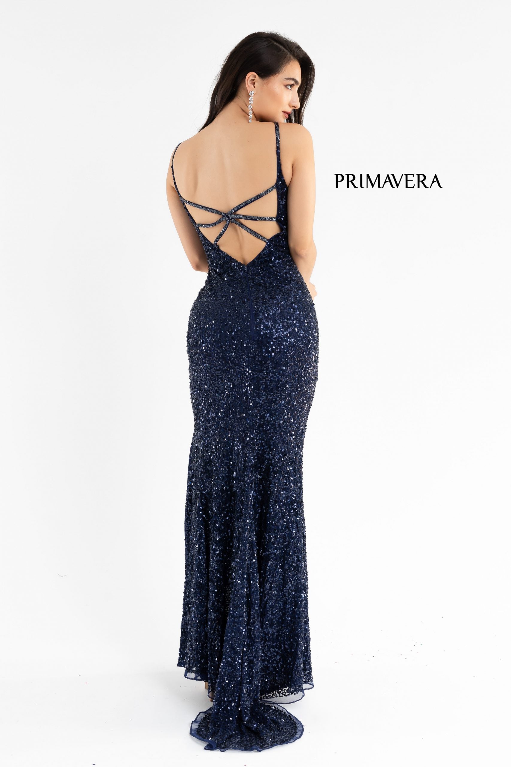 Primavera Couture 3792 Exclusive Prom Dress.  This sequin long prom dress with a v neckline and a side slit.  This dress features an open back with three straps on each side that meet in the middle. The prom dress ends in a sweeping train.  Colors:  Black  Sizes:  00, 6