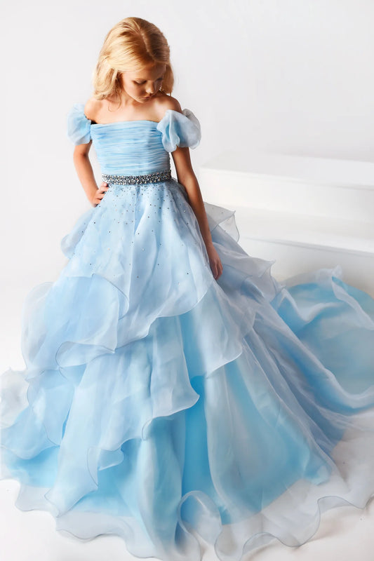 The Ava Presley 38025 Long Ruffle layer A Line Ballgown is designed for girls' pageant wear, offering classic style and sophistication. Its off-the-shoulder design features a puff sleeve, ruffle layer and detailed craftsmanship for an elegant look. Made of soft and durable fabric, it offers superior comfort and long-lasting wear.  Sizes: 2-16  Colors: Light Blue, Coral, White