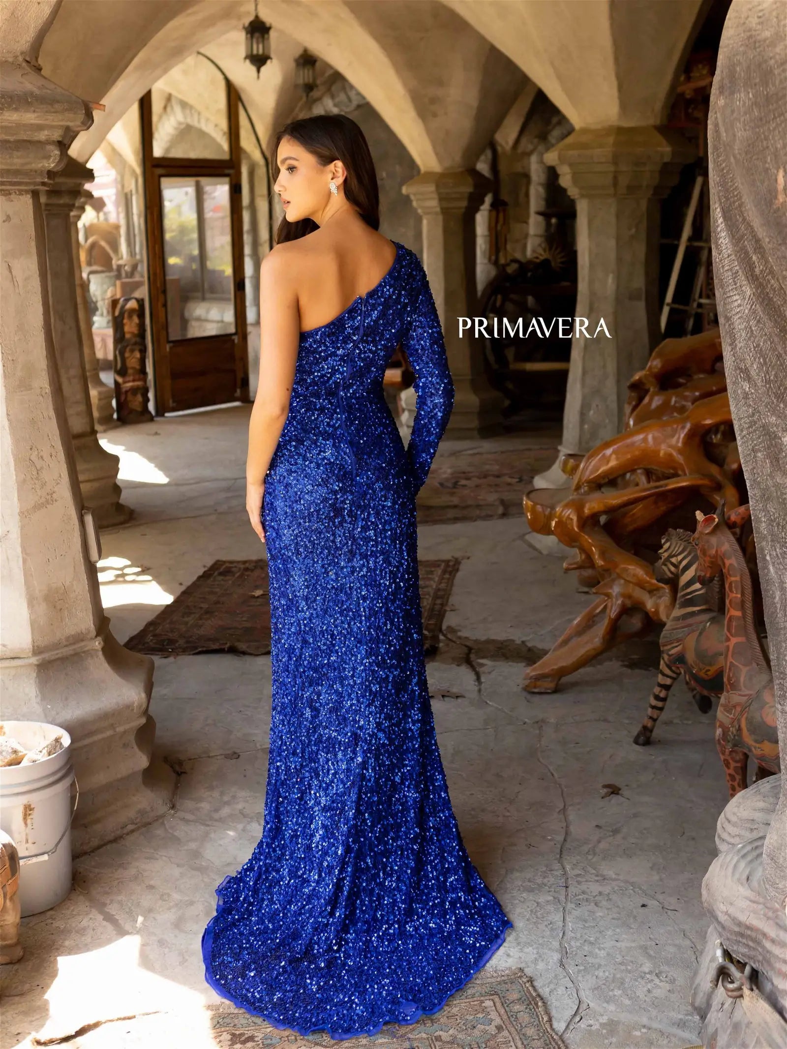 Primavera Couture 3942 Prom Dress Long Beaded Gown. This Gown has such a beautiful slit plus a long sleeve.