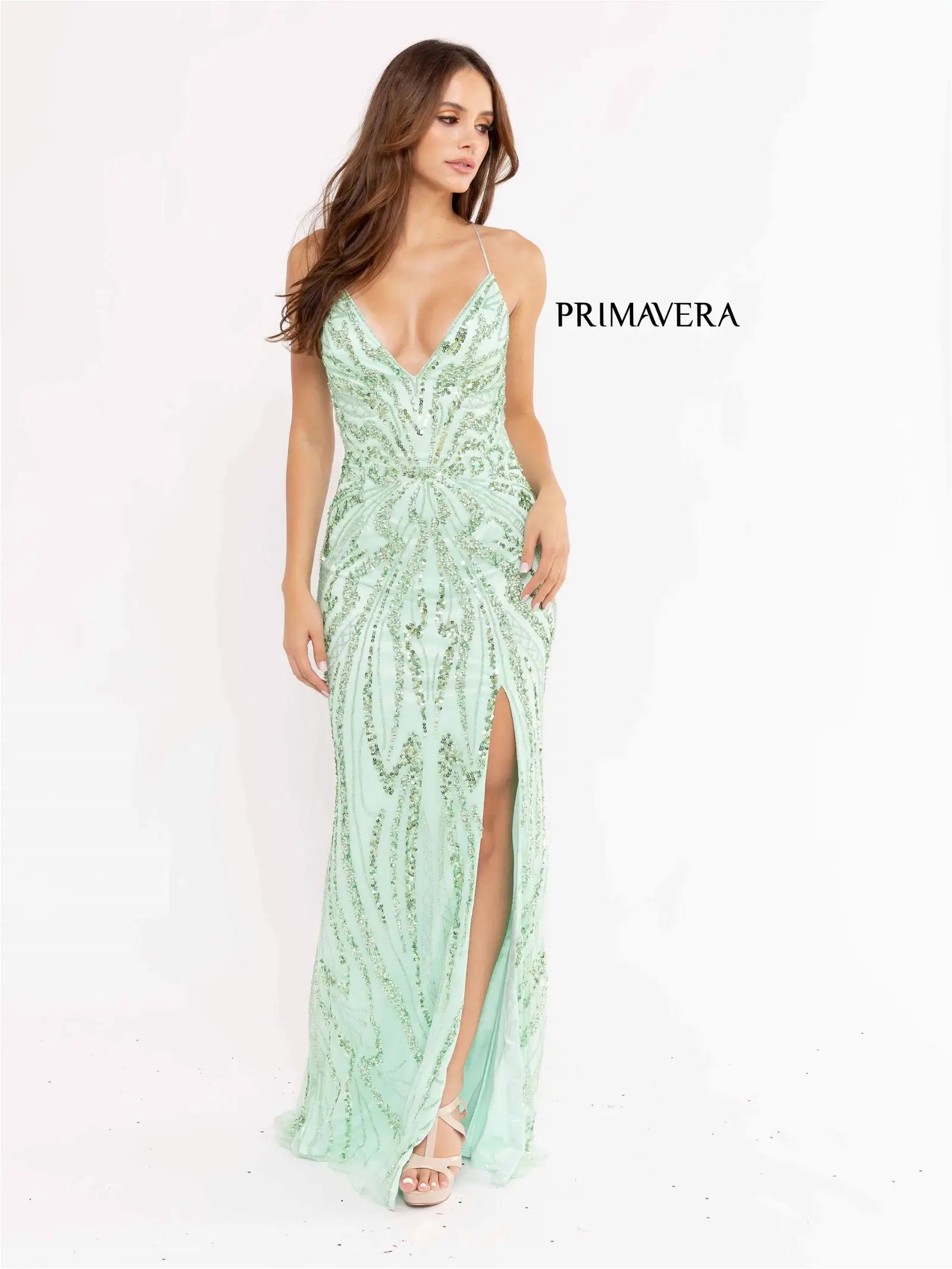 Primavera Couture 3958 Prom Dress Long beaded Gown. Its has a slit and a beautiful design on the gown.