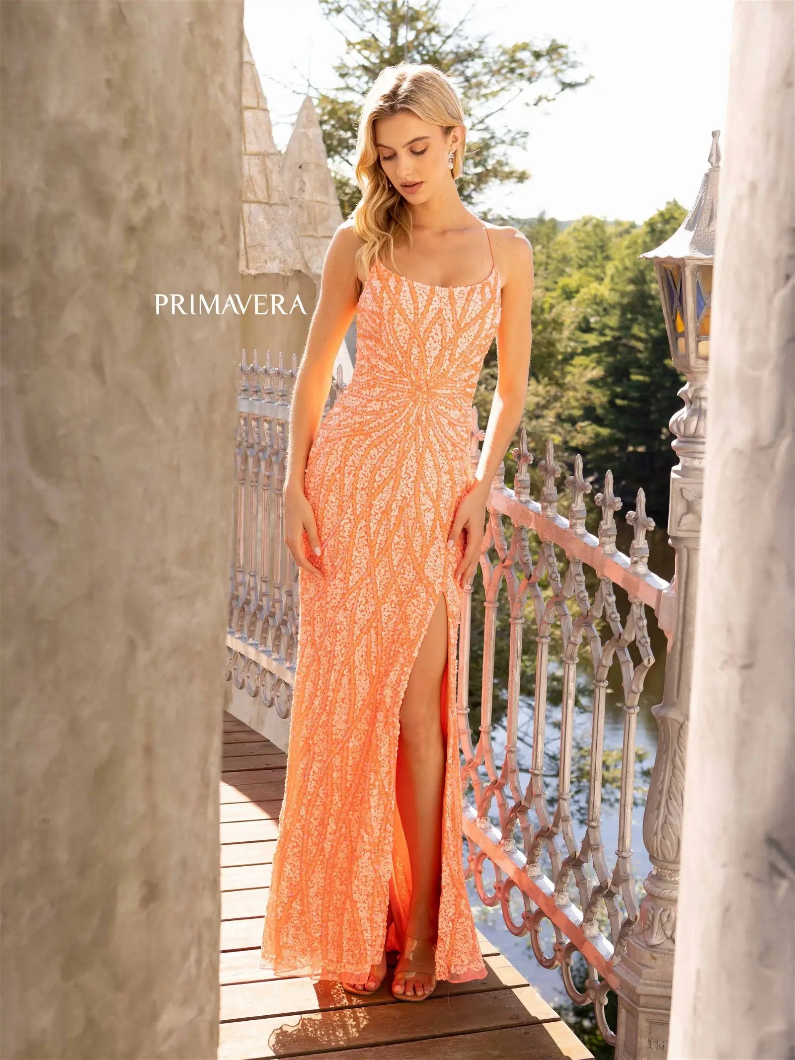 Primavera Couture 3959 Prom Dress Long Beaded Gown. This Gown has a beautiful design all over. Primavera Couture 3959 Sequin Scoop neck Prom Dress Backless Corset Slit Formal Gown  Size-000-18  Colors-Lilac, Coral