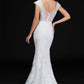 Nina Canacci 4203 is a long fitted embellished lace mermaid wedding dress. featuring a sweetheart neckline with cap sleeves with eyelash lace and a sheer lace back. Great destination bridal gown. Great for Plus Size. Mermaid fit & Flare Silhouette with a trumpet skirt  Available Sizes: 18  Available Colors: Ivory