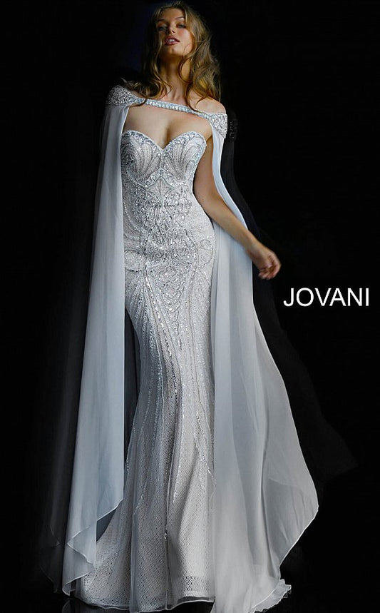 Jovani 45566 is a true stunner! This long Fitted strapless sweetheart neckline features a fully Crystal Embellished and Beaded Vintage Couture Design bodice. Sheer lace underlay. This Wedding Dress is fit for a Goddess. Over the shoulder Crystal embellished Sheer Cape Perfect for cool weather & an magical awe factor. This gown is a true red carpet masterpiece! Fuchsia is a perfect Barbie look for your next Pageant & Is 100% Stage Worthy!   Available Colors: charcoal, fuchsia, ivory  Available Sizes: 00-24