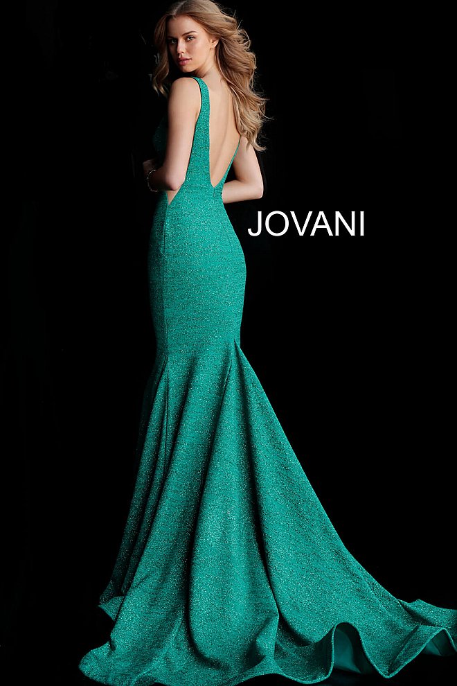 Jovani  47075 Floor length form fitting glitter jersey prom dress with train and horse hair trim features sleeveless bodice with plunging neckline, sheer side panels and open back. Evening gown, pageant gown, prom dress  Available colors:  blush, gunmetal, light-blue, navy, sage, white, wine, berry, black/multi, fuchsia, jade, mauve, ocean, peacock, red, soft blue/silver, yellow/silver, black/gold