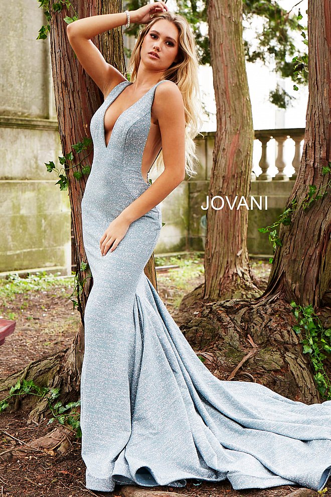 Jovani  47075 Floor length form fitting glitter jersey prom dress with train and horse hair trim features sleeveless bodice with plunging neckline, sheer side panels and open back. Evening gown, pageant gown, prom dress  Available colors:  blush, gunmetal, light-blue, navy, sage, white, wine, berry, black/multi, fuchsia, jade, mauve, ocean, peacock, red, soft blue/silver, yellow/silver, black/gold