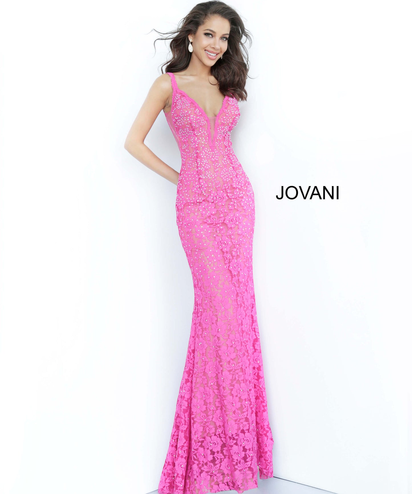 Jovani 48994 Stretch lace prom dress embellished with heat set stones, nude underlay, fitted silhouette, straps over shoulders, plunging v neckline with sheer mesh, sheer mesh inserts along the sides, sweeping train, low v back. Makes an excellent pageant gown or evening gown.   Available colors:  black, bright pink, emerald, fuchsia, grey, light-blue, light-pink, lilac, navy, peach, periwinkle, red, white  Available sizes:   00, 0, 2, 4, 6, 8, 10, 12, 14, 16, 18, 20, 22, 24