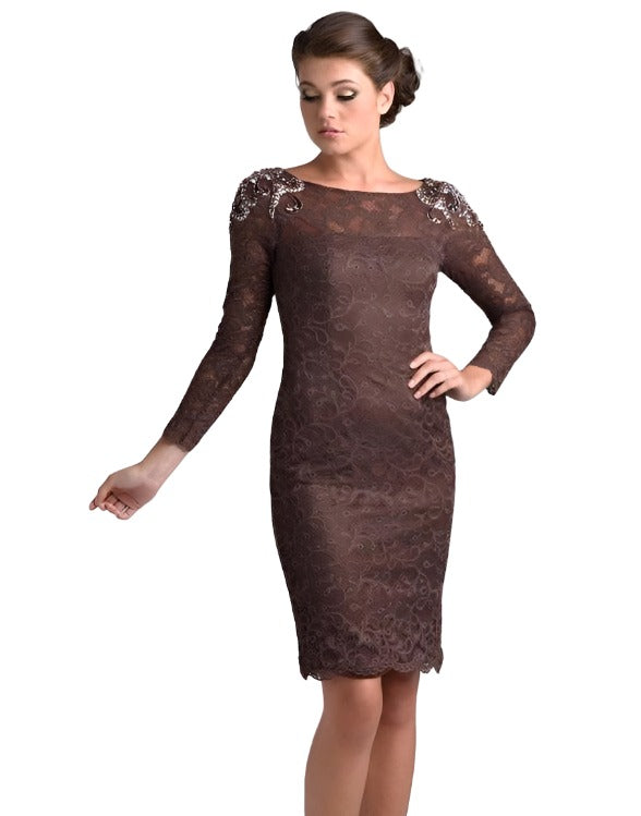Nina Canacci M208 is a short fitted lace knee length cocktail dress. Sheer High lace neckline with long sleeves. beading, Crystal Rhinestones & Embellishments adorn the shoulder on this great mother of the bride/groom style. Available Sizes: 6, 8, 10  Available Colors: Brown