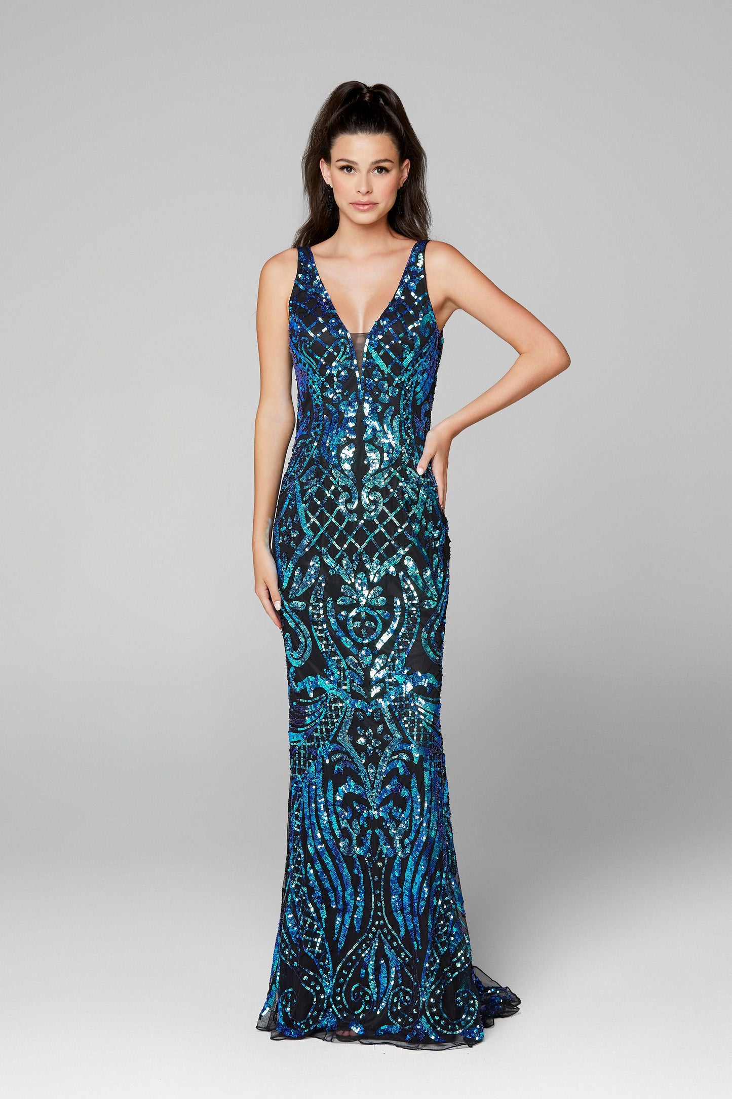 Primavera Couture 3612 is a long Fitted Sequin Embellished Formal Evening Gown. Featuring a Plunging Deep V Neckline. Elegant Sequin Embellishments scroll down throughout the length of this fit & Flare Prom Dress.  Available Sizes: 00,0,2,4,6,8,10,12,14,16,18  Available Colors: Black/Blue, Black/Multi, Ivory, Yellow