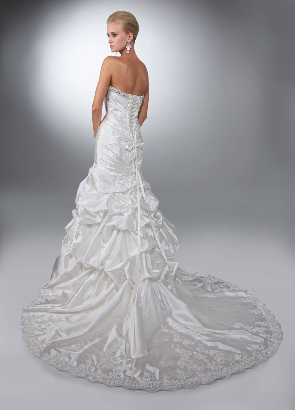 DaVinci Bridal 50084 Available in Size 10 Ivory strapless mermaid wedding dress  Taffeta fit and flare gown with a strapless neckline trimmed with beading. Lace applique on the bodice is wrapped with pleated taffeta. Pick ups at top of the skirt and a lace hem on the bottom skirt with a lace up back. 