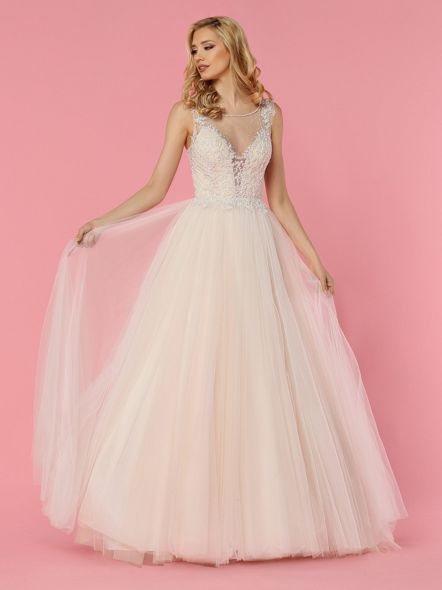 Davinci Bridal 50457 is a soft tulle ballgown wedding dress. Featuring a Crystal Embellished Bodice with a sheer mesh plunging neckline and sheer open back with Embellishments and buttons down the seam. Lace cascading from the bodice into the soft Lush Tulle skirt.  Available for 1-2 Week Delivery!!!  Available Sizes: 2,4,6,8,10,12,14,16,18,20  Available Colors: Ivory/Blush, Ivory/Ivory
