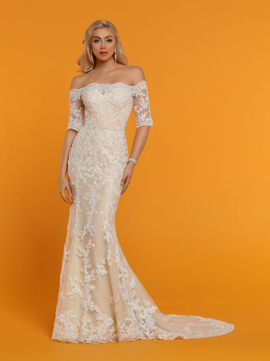 Davinci Bridal 50529 is a long Fitted Mermaid Silhouette wedding dress. Featuring an Illusion sweetheart neckline with sheer lace straight off the shoulder 1/2 sleeves. The back also features a sheer lace backing. Lace Clustered along the bodice and begins to break up as it cascades down into the skirt. Lace edge hem and train.  Available for 1-2 Week Delivery!!!  Available Sizes: 2,4,6,8,10,12,14,16,18,20  Available Colors: Ivory/Nude, Ivory/Ivory