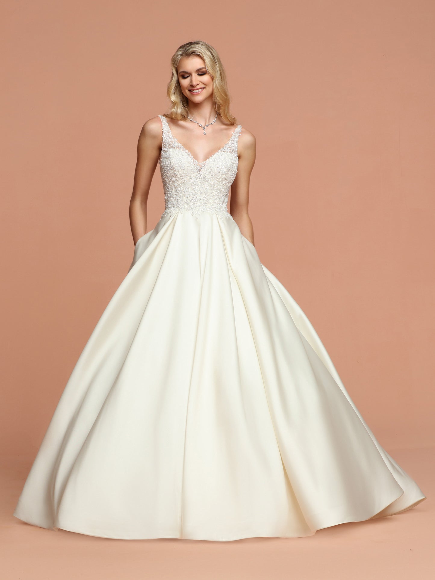 Davinci Bridal 50580 is a Sleek Mikado A-Line Ball Gown Wedding Dress with V-Neckline,Deep V-Back & Beaded Bodice. Full Mikado Ball Gown Skirt with Pleated Waist has Chapel Train. Hand Beading with Lace Applique, Pockets, Sequin Accent, V-Back, Zipper  Available for 1-2 Week Delivery!!!  Available Sizes: 2,4,6,8,10,12,14,16,18,20  Available Colors: Ivory  Available Colors: Ivory, White