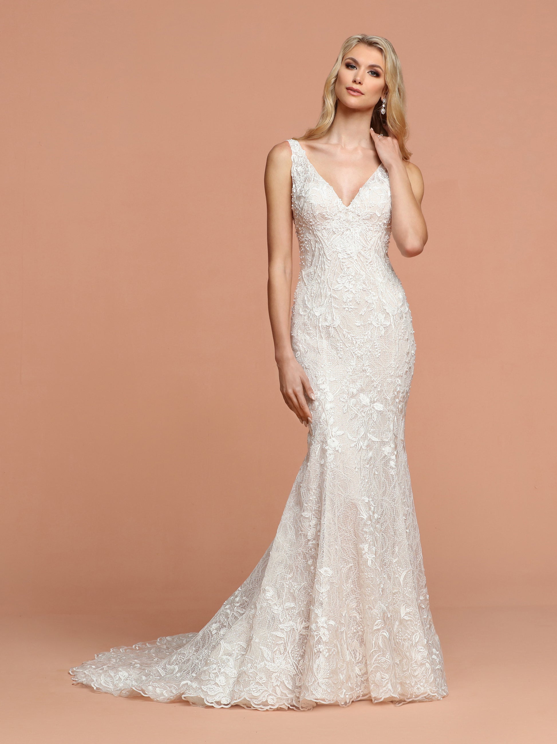 Davinci Bridal 50582 is a long Fitted All over Lace Embellished Wedding Dress. Featuring a V neckline with an open V back. Stunning gown is Hand beaded with a full lace train.  Available for 1-2 Week Delivery!!!  Available Sizes: 2,4,6,8,10,12,14,16,18,20  Available Colors: Ivory/Blush, Ivory/Ivory  Available Colors: Ivory/Blush, Ivory/Ivory