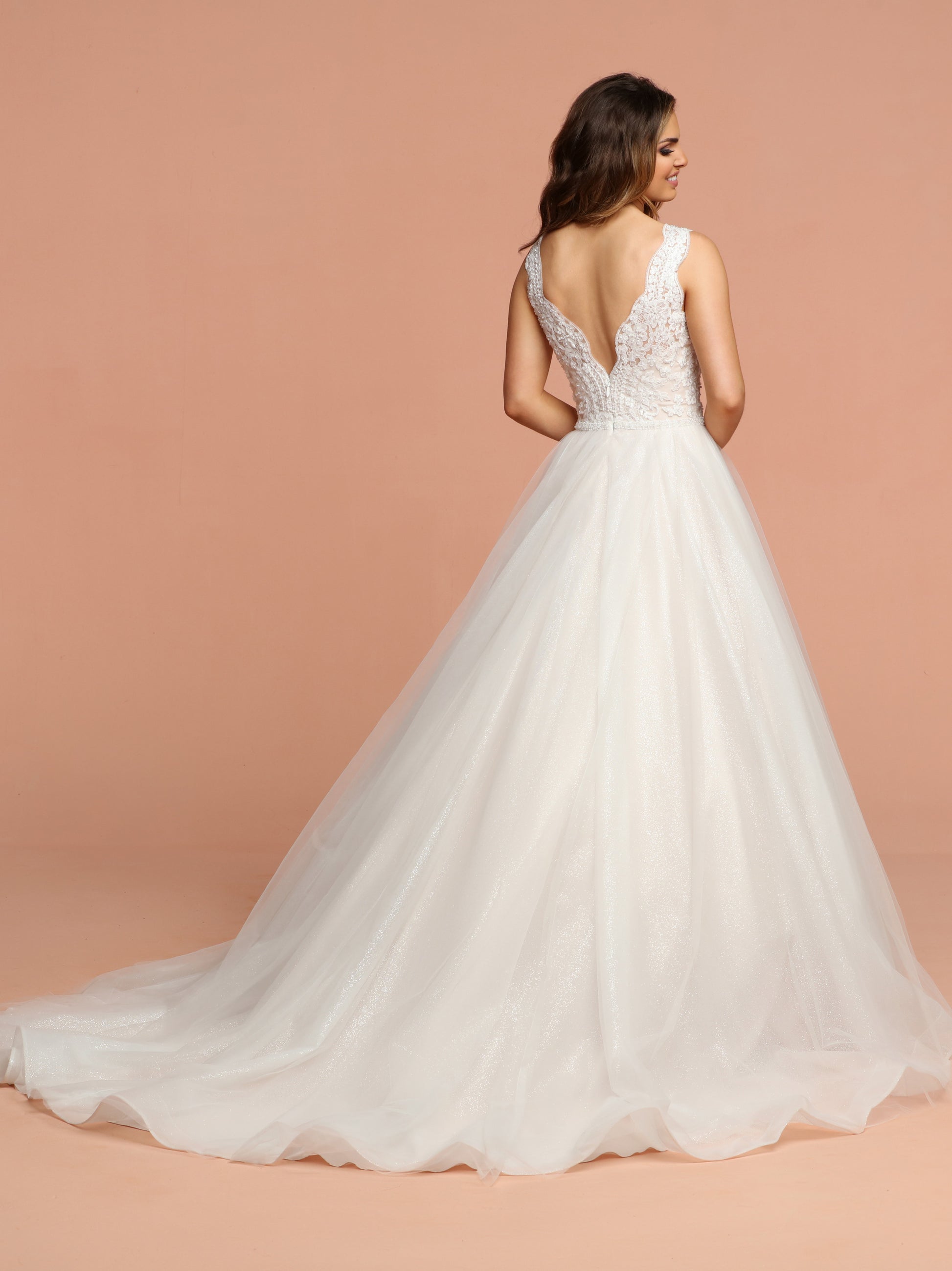 Davinci Bridal 50589 is a Gorgeous Glitter Shimmer Tulle Ballgown Wedding Dress. Featuring a beautiful eyelash lace embellished bodice with a V neckline and open V back. The full tulle skirt shimmers with a full train.  Available for 1-2 Week Delivery!!!  Available Sizes: 2,4,6,8,10,12,14,16,18,20  Available Colors: Ivory/Blush, Ivory/Ivory