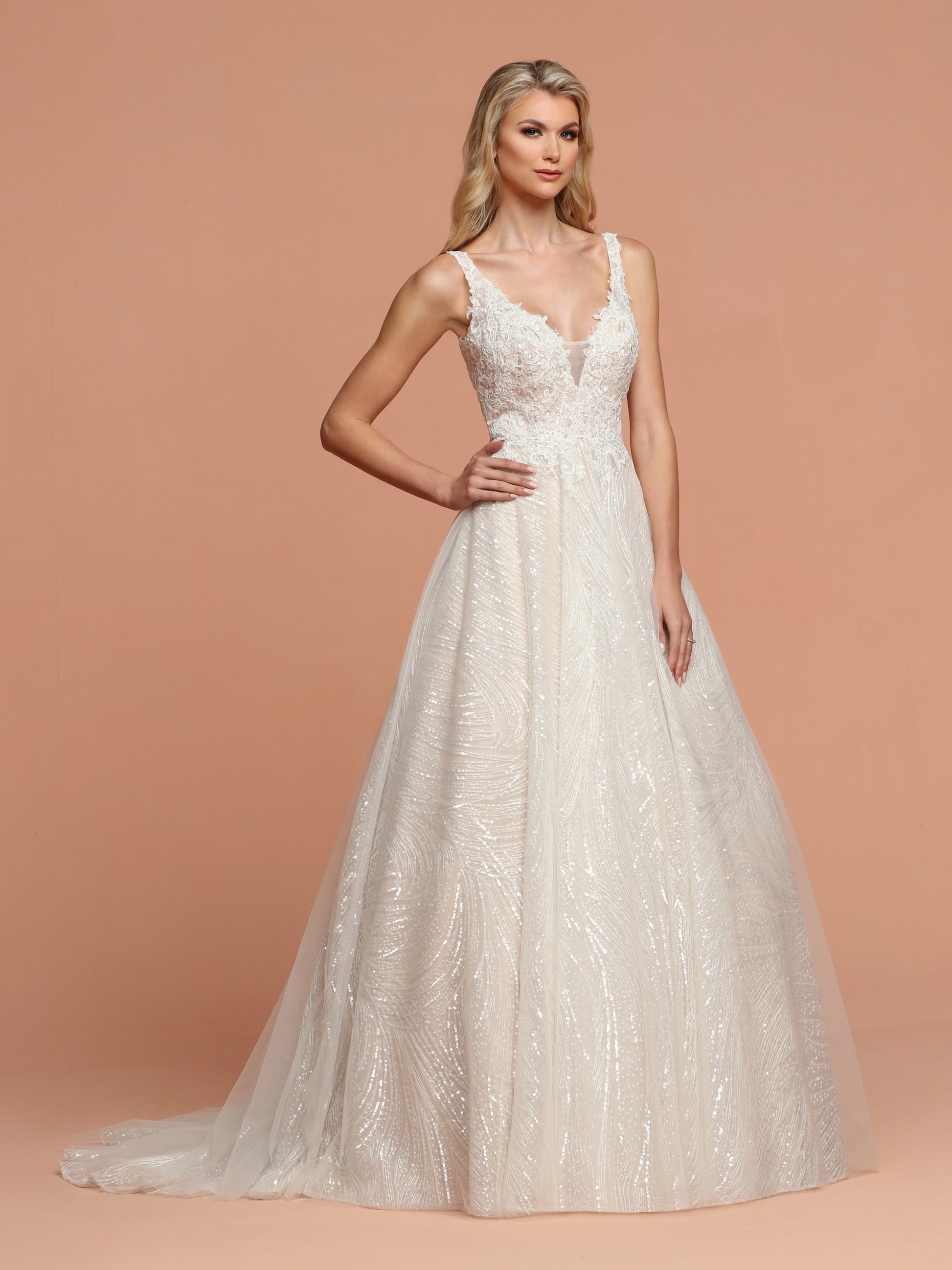 Davinci Bridal 50591 is a Ballgown Bridal Gown Featuring a Full Embellished Tulle Skirt for a stunning Shimmer on your Big Day! The Bodice features a V Neck with a mesh insert and an open V beck. Embellished Lace Bodice with straps.  Available for 1-2 Week Delivery!!!  Available Sizes: 2,4,6,8,10,12,14,16,18,20  Available Colors: Ivory/Nude, Ivory/Ivory  Available Colors: Ivory/Nude, Ivory/Ivory