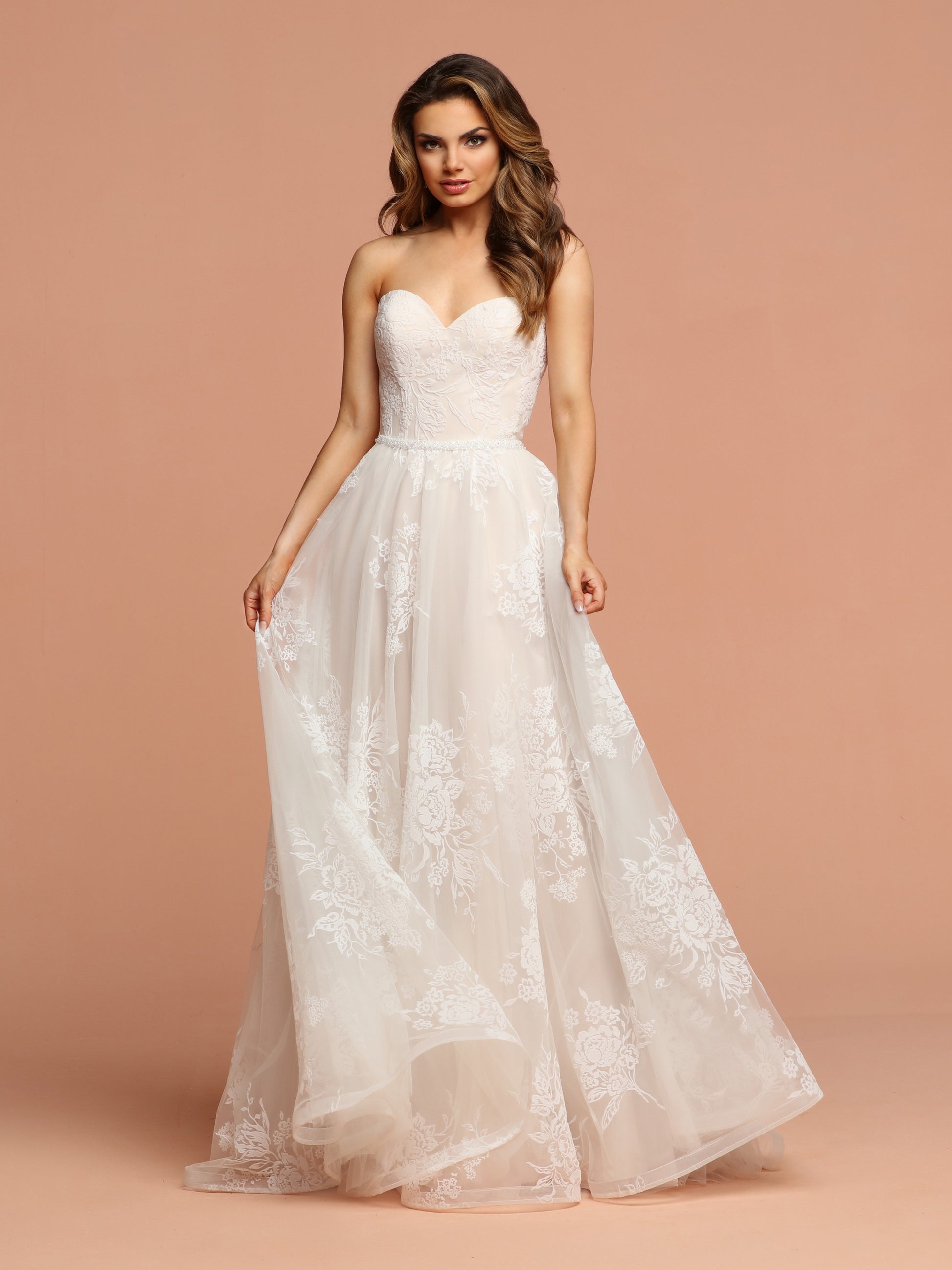 Davinci Bridal 50599 This flowing tulle gown has soft velvet like flowers throughout.  The sweetheart strapless bodice has a beaded belt at the waist extending into a lace up back. Available for 1-2 Week Delivery!!!  Available Sizes: 2,4,6,8,10,12,14,16,18,20  Available Colors: Ivory/Blush, Ivory/Ivory
