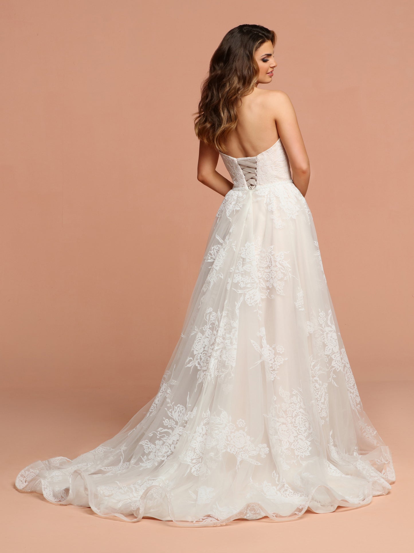 Davinci Bridal 50599 This flowing tulle gown has soft velvet like flowers throughout.  The sweetheart strapless bodice has a beaded belt at the waist extending into a lace up back. Available for 1-2 Week Delivery!!!  Available Sizes: 2,4,6,8,10,12,14,16,18,20  Available Colors: Ivory/Blush, Ivory/Ivory